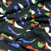 Tissu Microfibre de viscose noir aux tâches géométriques oranges, écrues, bleues et vertes - OEKO-TEX® - tissuspapi