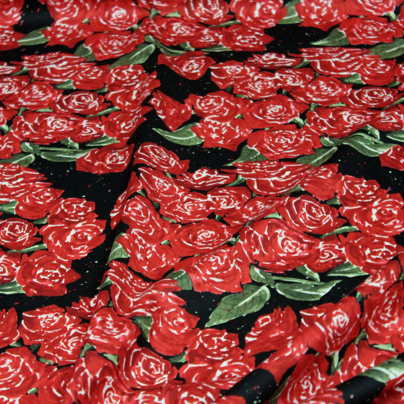Tissu popeline de coton aux fleurs de roses rouges fond noir - TissusPapi.com