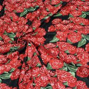 Tissu popeline de coton aux fleurs de roses rouges fond noir - TissusPapi.com
