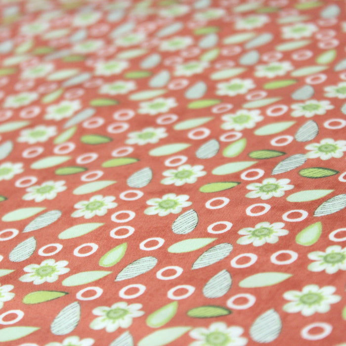 Tissu popeline de coton orange aux petites fleurs blanches et vertes - tissuspapi