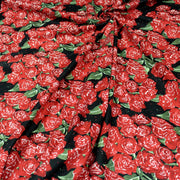Tissu popeline de coton aux fleurs de roses rouges fond noir - TissusPapi.com