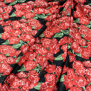 Tissu popeline de coton aux fleurs de roses rouges fond noir - TissusPapi.com