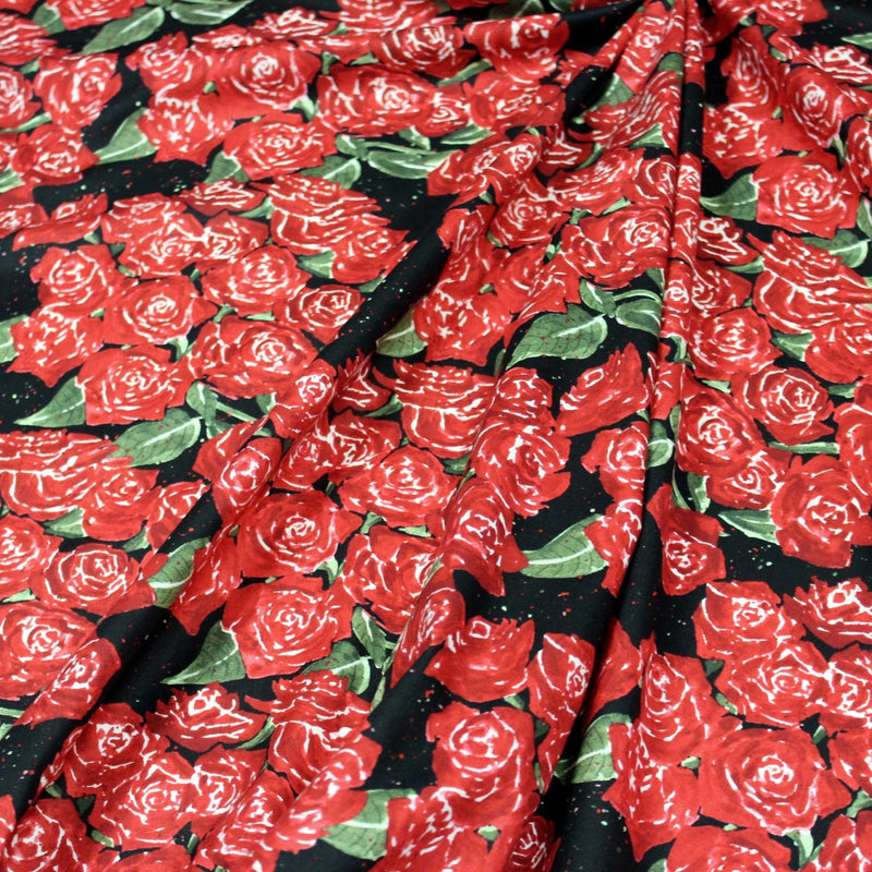 Tissu popeline de coton aux fleurs de roses rouges fond noir - TissusPapi.com