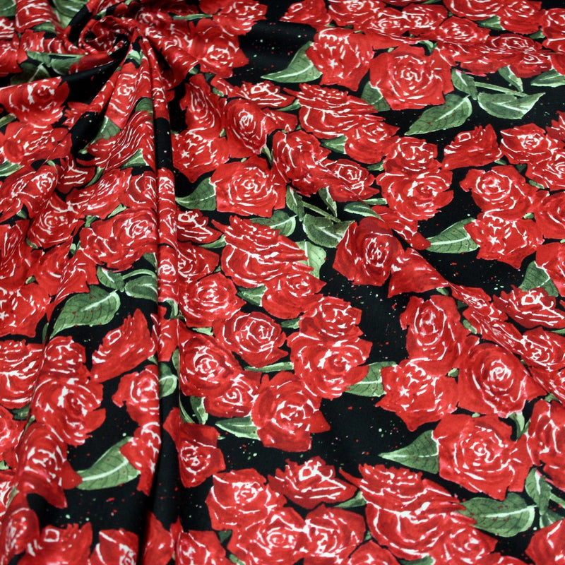 Tissu popeline de coton aux fleurs de roses rouges fond noir - TissusPapi.com
