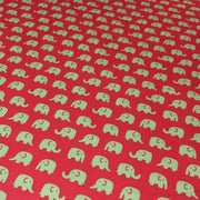Tissu cotonnade rouge aux éléphants verts - TissusPapi.com