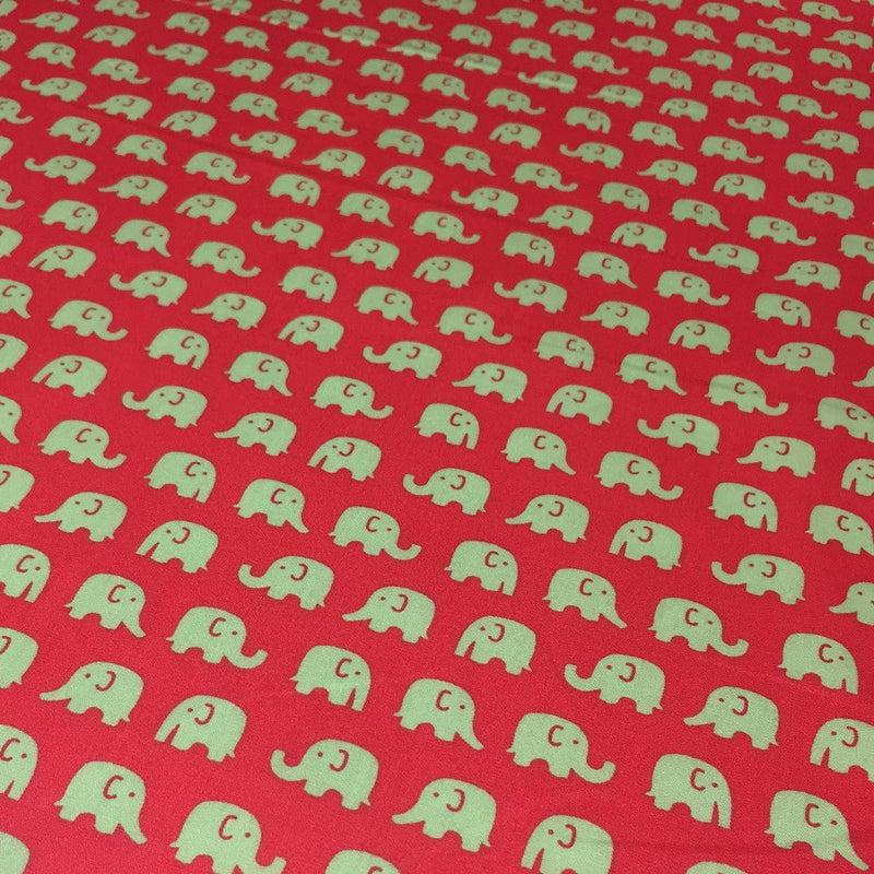 Tissu cotonnade rouge aux éléphants verts - TissusPapi.com