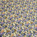 Tissu popeline de coton ELISABETH aux fleurs parme, bleues & ocre, fond écru