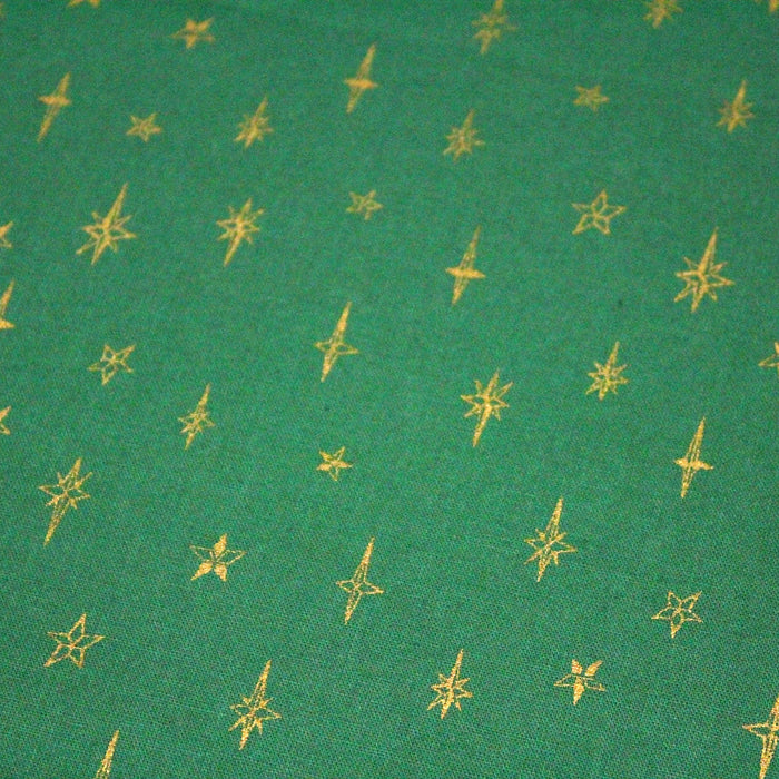 Tissu de coton de Noël aux étoiles dorées, fond vert - tissuspapi
