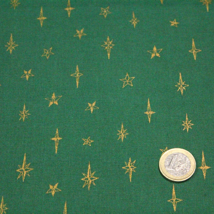 Tissu de coton de Noël aux étoiles dorées, fond vert