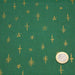 Tissu de coton de Noël aux étoiles dorées, fond vert