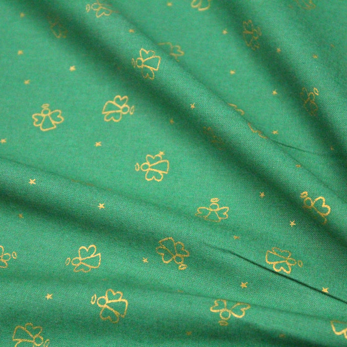 Tissu de coton de Noël aux anges dorés, fond vert