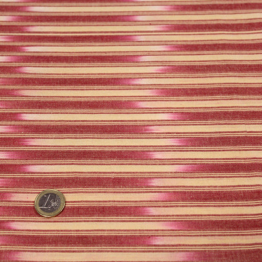 Tissu de coton crème à liserés rouges & motif ikat